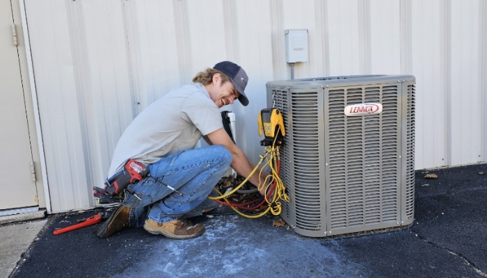 Technician Performing Maintenance Lennox System Technician Performing Maintenance Lennox System