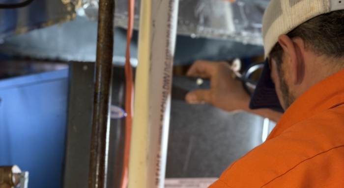 Technician With Furnace